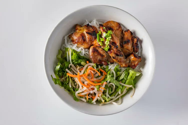 Vermicelli noodle bowl with grilled chicken, lettuce and pickled carrots