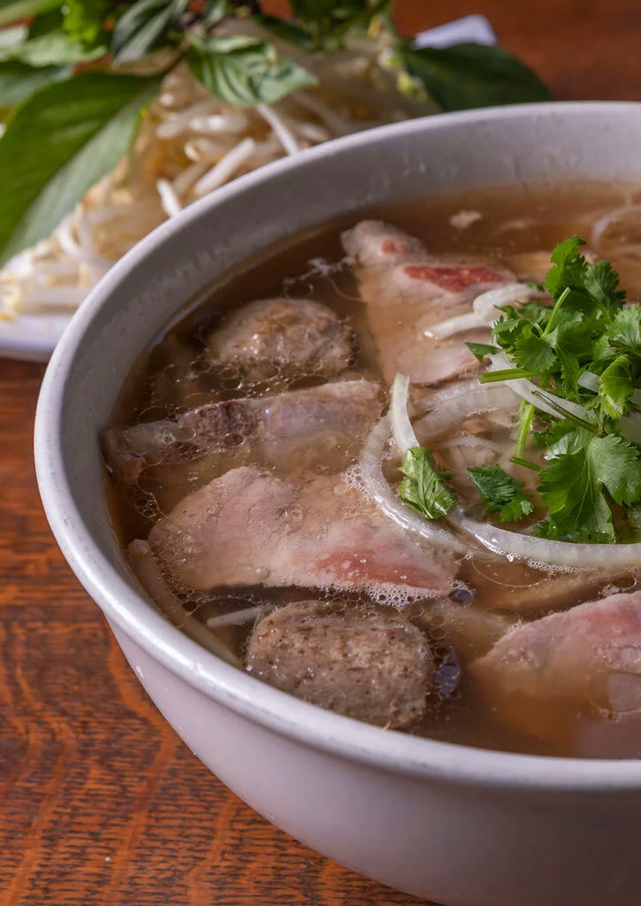Steaming bowl of Monster Pho beef pho